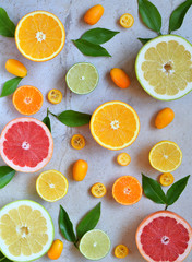 Set of citrus on light background: orange, mandarin, lemon, grapefruit, lime, kumquat, tangerine. Fresh organic juicy fruits. Source of vitamin C. Healthy food concept. Copy space