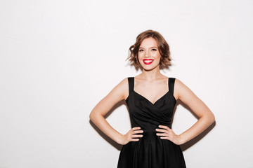 Wall Mural - Portrait of a happy girl dressed in black dress