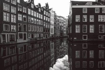 Wall Mural - Amsterdam buildings on the water in black and white , Netherlands.