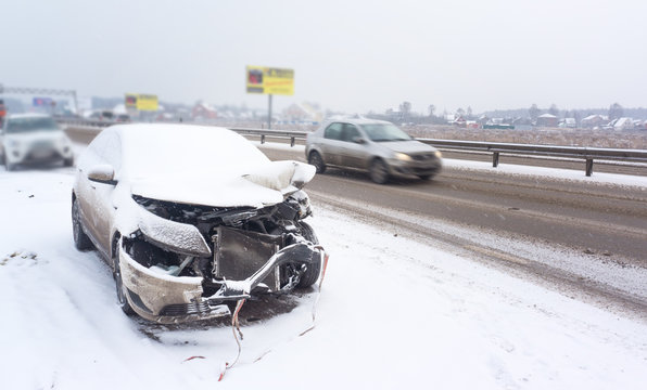 Fototapete - An accident with a white car in winter on road, slippery icy road, danger driving