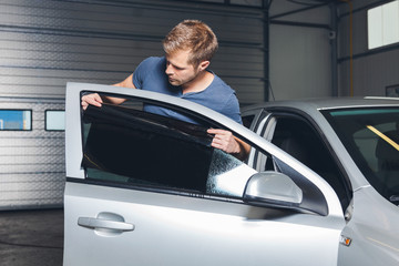 Applying tinting foil onto a car window