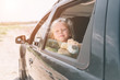 Travel, tourism - Girl with teddy bear ready for the travel for summer vacation. Child going on Adventure. Car travel concept