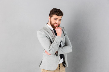 Wall Mural - Portrait of a smiling businessman dressed in suit