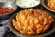 Homemade Blooming Onion with dipping sauce, selective focus