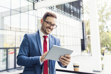 Wall Mural - Businessman using tablet