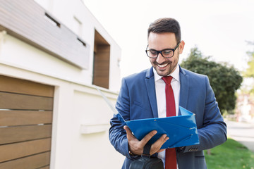 Wall Mural - Businessman opening folder