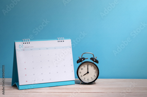 Fotografía Vintage clock and calendar on wood, time concept