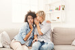 © Prostock-studio - Young woman telling her friend some secrets