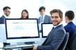 © ASDF - Businessman analyzing economic graphs at office