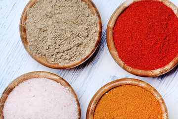 Poster - Spices in a bamboo bowls on table