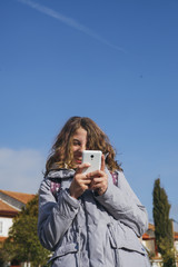 Wall Mural - teenage girl student with smartphone