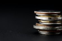Closeup Of Coins Stack Isolated On Black Background