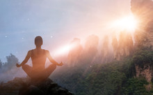 Woman Meditating Yoga In Sunset Mountains With Nature. Outdoor Sport Exercise And Relaxation Concept