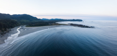 Aerial Panoramic Landscape View of Pacific Ocean Coast in Washington State. Taken during a vibrant sunrise.