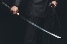 Cropped Shot Of Man With Katana Sword On Black Background