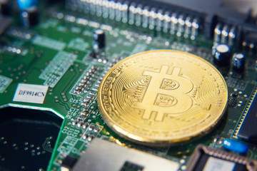 Wall Mural - golden bitcoin coin lying on green computer keyboard, cryptocurrency bubble investing concept
