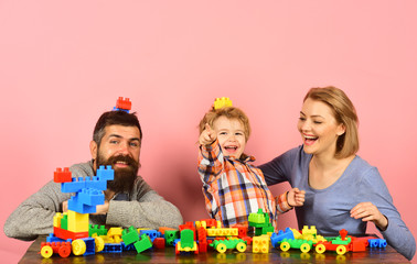 Man with beard, woman and boy play on pink background