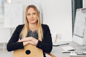 Poster - Businesswoman looking over the back of her chair