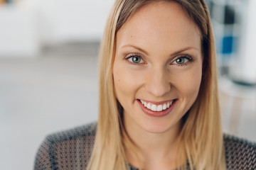 Wall Mural - Close up head shot of a smiling happy blond woman