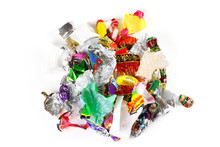 A Bunch Of Candy Wrappers On A White Background. Closeup