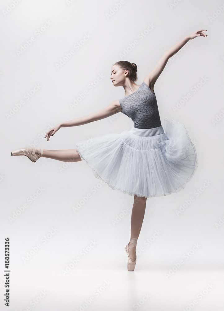 Young classical dancer isolated on white background. - obrazy, fototapety, plakaty 