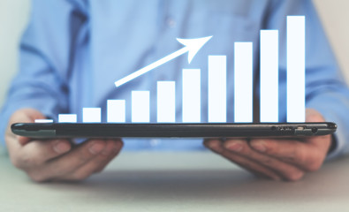 Businessman with business growth graph.