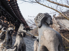 Row Of Stone Roof Figurines At The Huayan Temple At Mountain Laoshan, Qingdao, China