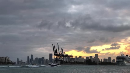 Wall Mural - a trio of cruise ships pass the cloudy skyline at the port of miami, florida