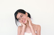 © Wasana - Beauty Skincare concept-  Head Shot portrait of Young Asian woman wearing glasses smiling and laughing
