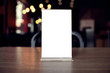 © Charlie's - Mock up Menu frame standing on wood table in Bar restaurant cafe. space for text