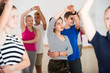 © JackF - Group of teen dancing salsa in dance studio