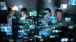 © metamorworks - Group of people watching holographic visions.