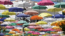 Color Umbrella Heap In A Village Square A Sunny Day