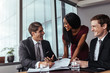 © Jacob Lund - Business people signing a contract paper