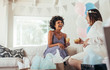 © Jacob Lund - Happy pregnant woman and her friend at baby shower