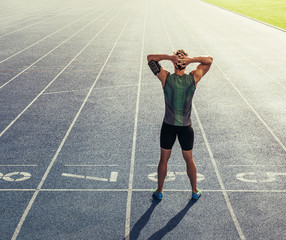 Wall Mural - sprinter warming up before a race