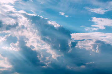 Wall Mural - white curly clouds in a blue sky. sky background