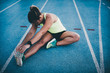 © Criene Images - Female athletic woman stretching after running workout