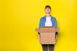 © All king of people - isolated woman on yellow with cardboard box