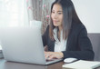 © sayayute - Asian business woman using laptop.