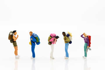 Miniature people: Travelers standing on white background , Image use for travel concept.