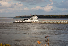 Modern Towboat Pushing A Barge On The Mississippi River