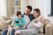 © Syda Productions - happy family with smartphone at home