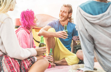 Wall Mural - Group of happy friends drinking beers beers in tents camping