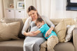 © Syda Productions - happy pregnant mother and son hugging at home