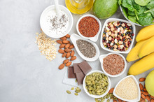 Healthy Food Nutrition Dieting Concept. Banana, Chocolate, Spinach, Avocado, Apple, Quinoa, Chia, Flax Seeds, Yogurt, Almond, Beans, Oat, Pumpkin Seeds, Olive Oil. Top View, Flat Lay, Copy Space.