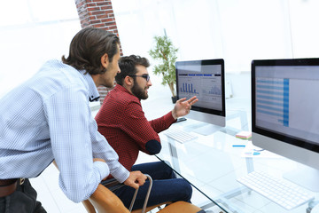 Canvas Print - employees of the company, discussing the statistics