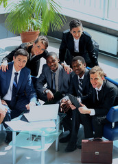 Poster - Satisfied proud business team looking at camera and smiling in office.