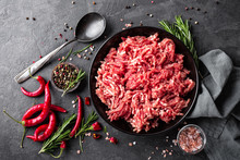 Mince. Ground Meat With Ingredients For Cooking On Black Background. Top View
