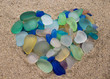 Colorful seaglass arranged in the shape of a heart